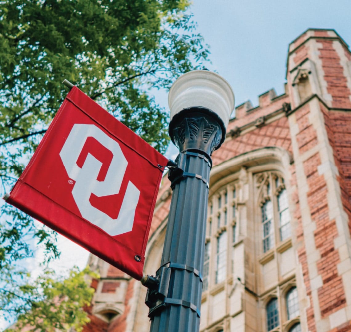 photo of the OU flag outside a school building