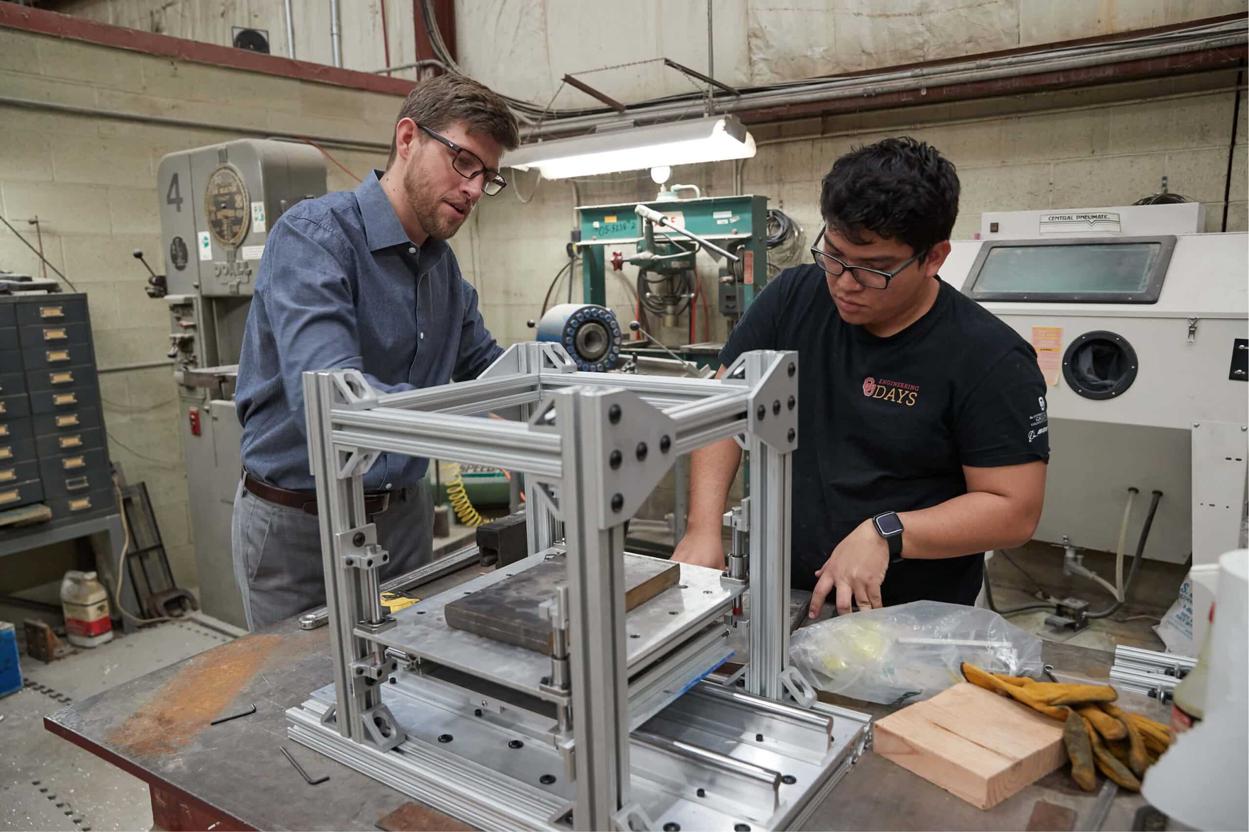 photo of two men using a 3d printer